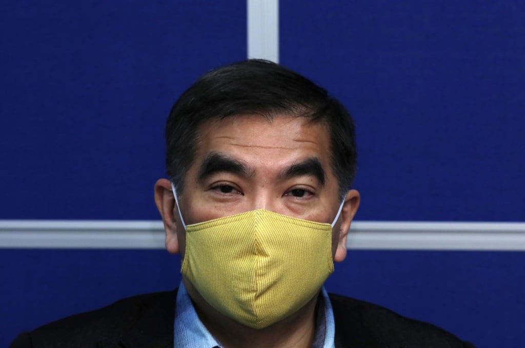 Textile and garment industry lawmaker Felix Chung shows a handmade washable face mask. Photo: Nora Tam
