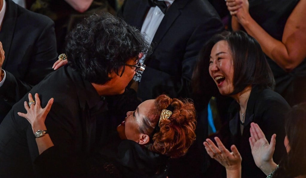 Parasite producers Bong Joon-ho (left), also the film’s director, and Kwak Sin-ae celebrate after winning the award for best picture for Parasite at the Academy Awards ceremony in Hollywood. Photo: AFP
