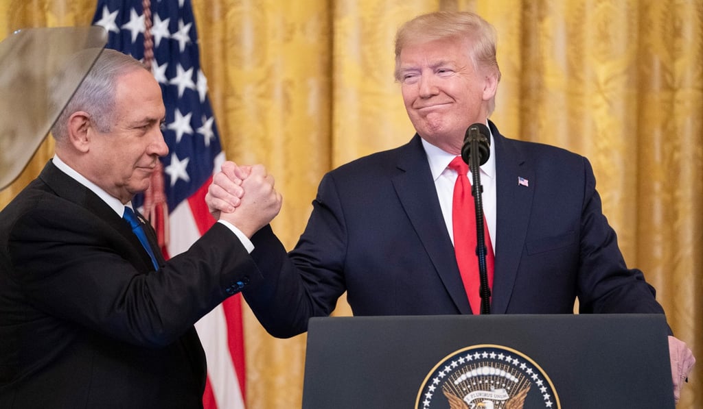 Israeli Prime Minister Benjamin Netanyahu and US President Donald Trump hold hands at the end of a joint press conference to announce the US' Middle East peace plan proposal. Photo: DPA Israeli Prime Minister Benjamin Netanyahu and US President Donald Trump hold hands at the end of a joint press conference to announce the US' Middle East peace plan proposal. Photo: DPA