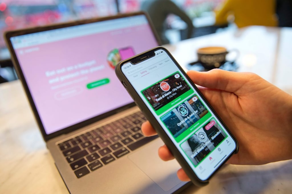 A Karma user browsing for available food. Photo: AFP A Karma user browsing for available food. Photo: AFP