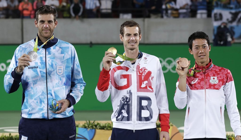 Andy Murray holds up his gold medal after winning the men’s singles at the 2016 Summer Olympics in Rio de Janeiro. Photo: AP