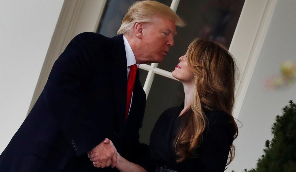 US President Donald Trump shakes hands with former White House communications director Hope Hicks outside the Oval Office in March 2018. Photo: Reuters