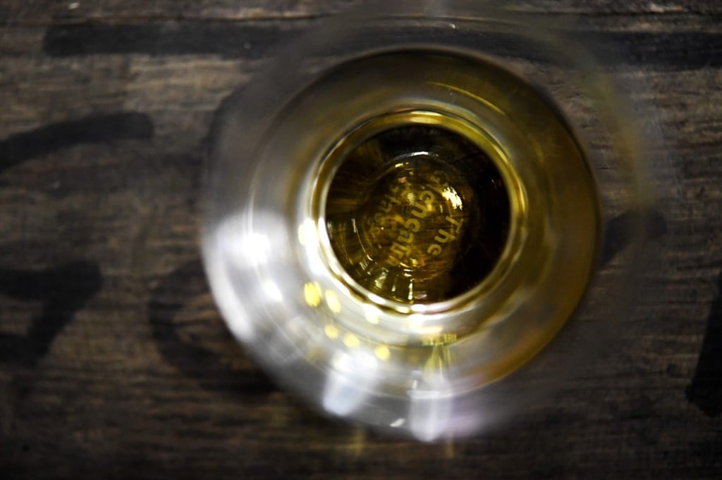 A glass of whisky made at the Warenghem distillery in Lannion, western France. Photo: AFP