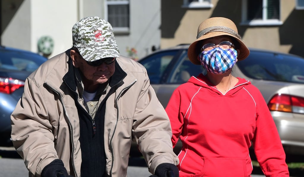 Face masks commonly worn by Asians to protect against germs or prevent their spread have become a flashpoint, with wearers insulted or attacked. Photo: AFP