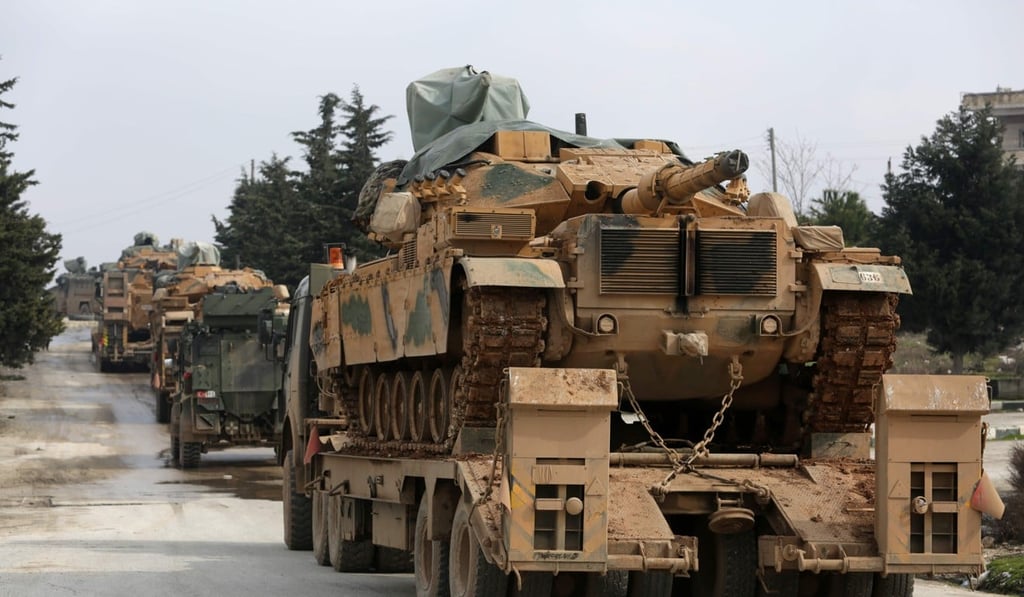 A Turkish military convoy passes along the M4 motorway by the town of Ariha, about 13km south of Idlib. Photo: AFP