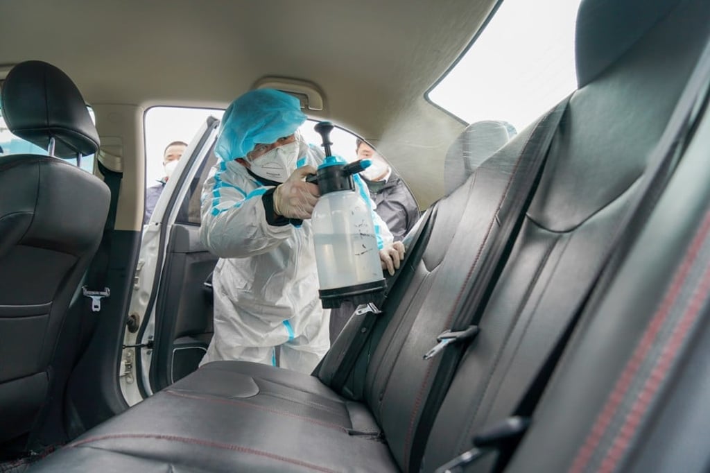 An employee of ride-hailing services provider Didi Chuxing disinfects a vehicle in Nanjing, in eastern China's Jiangsu province, on February 14. Photo: Xinhua