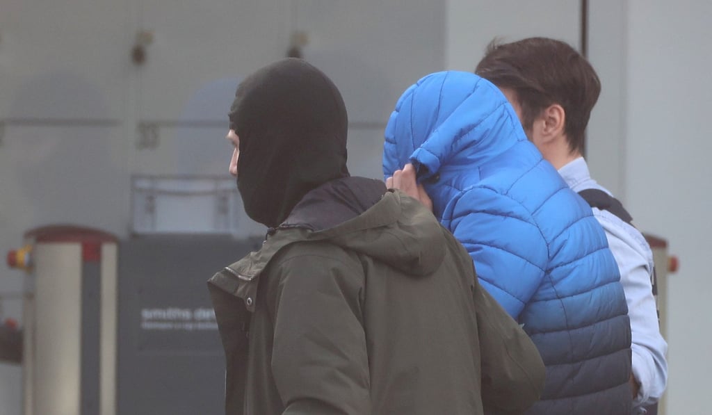 One of twelve men suspected of involvement in a far-right group is escorted by police as he arrives for his hearing at Germany's general prosecutor in Karlsruhe, Germany. Photo: Reuters One of twelve men suspected of involvement in a far-right group is escorted by police as he arrives for his hearing at Germany's general prosecutor in Karlsruhe, Germany. Photo: Reuters