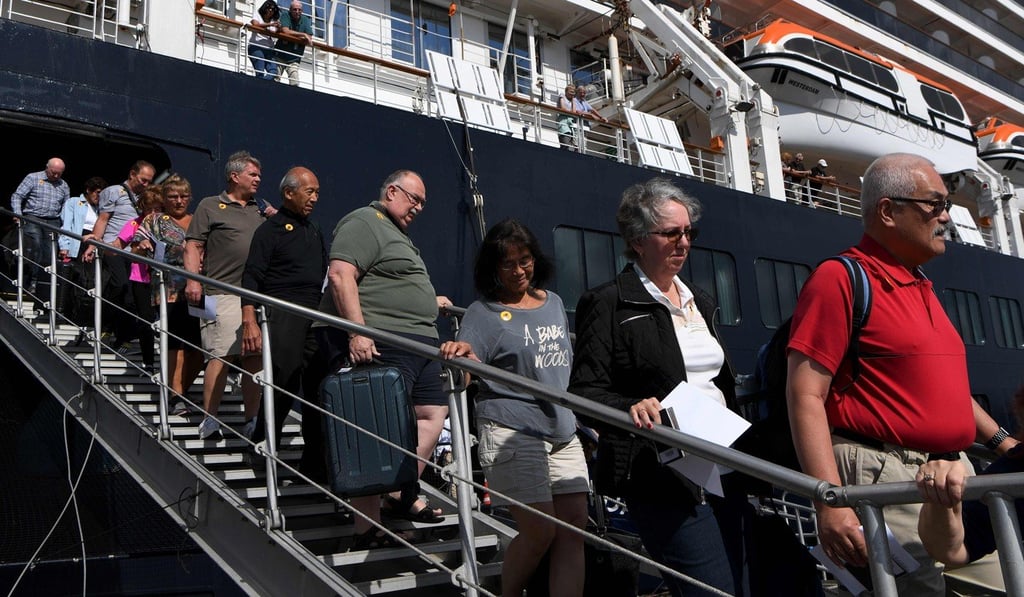 Passengers disembark from the Westerdam cruise ship in Sihanoukville on February 15, 2020. Photo: AFP