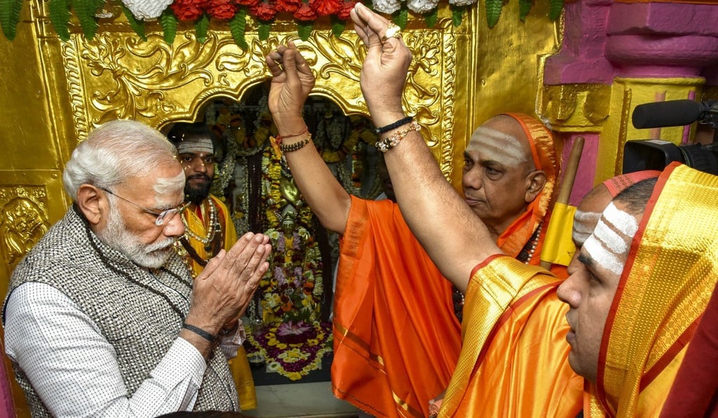 Indian Prime Minister Narandra Modi receives blessings after offering prayers at Jangamwadi Math in Varanasi on February 16. Modi’s nationalist BJP won by a landslide in the last two general elections, which many believe indicates a rightward shift of India’s majority Hindu population. Photo: PTI / dpa