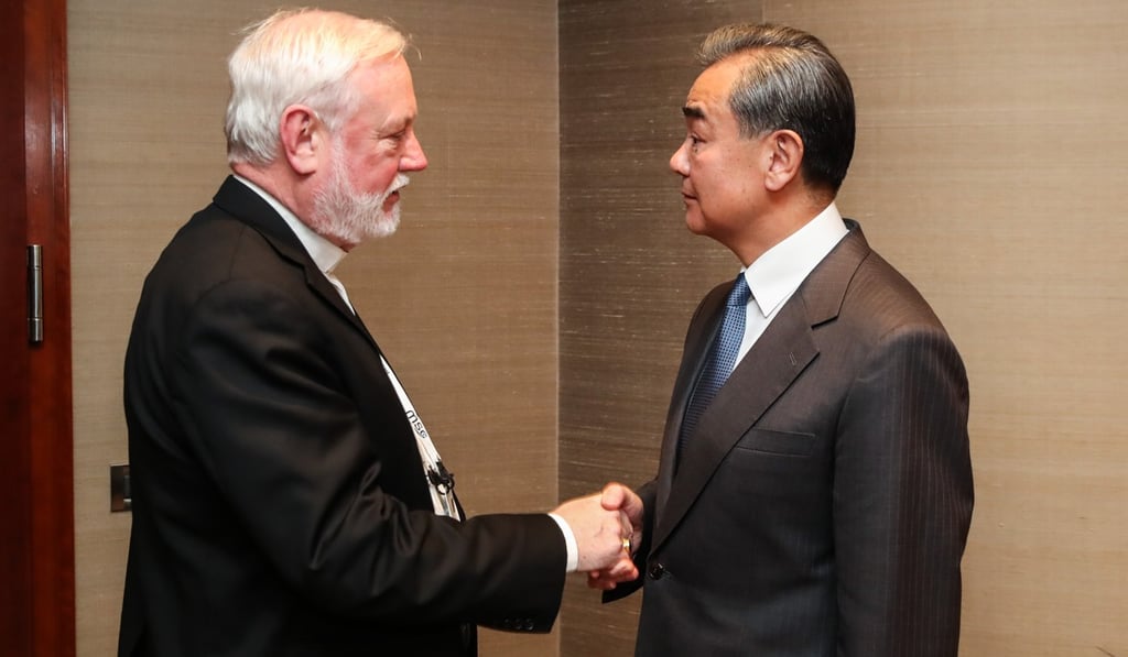 Archibishop Paul Gallagher and Wang Yi meet for talks on the sidelines of the Munich Security Conference on Friday. Photo: Xinhua