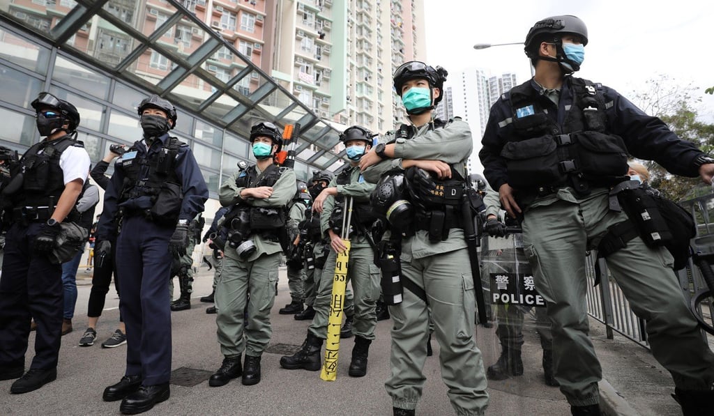 Riot police in masks. Photo: Dickson Lee