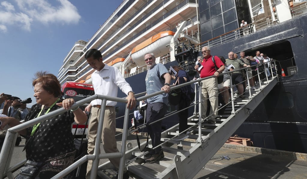 Passengers of the MS Westerdam disembark on February 15, 2020. Photo: AP