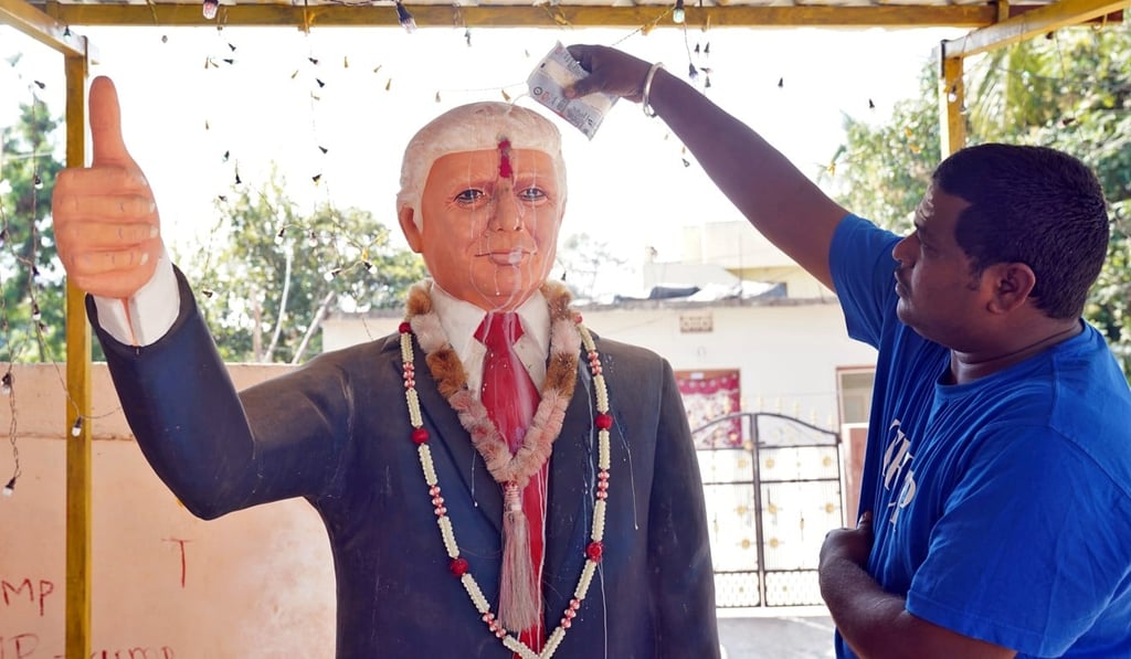 Bussa Krishna offers prayers to a statue of Trump at his house in Konney village in the southern state of Telangana, India. Photo: Reuters Bussa Krishna offers prayers to a statue of Trump at his house in Konney village in the southern state of Telangana, India. Photo: Reuters