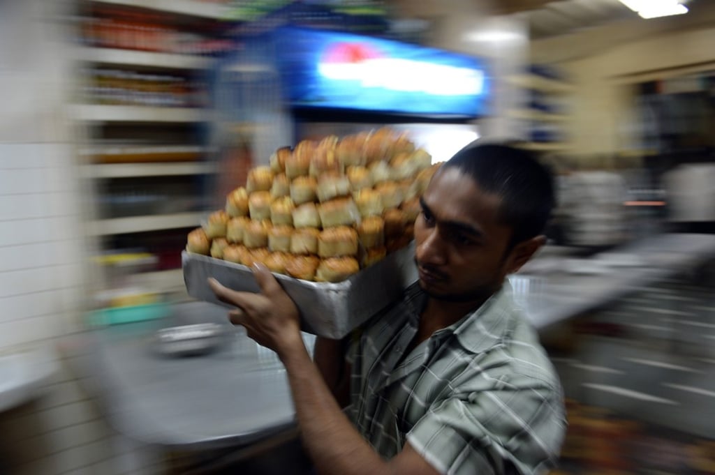 In their heyday, Irani cafes served businessmen and labourers alike. Today, fewer than 30 of them remain in Mumbai. Photo: AFP via Getty Images