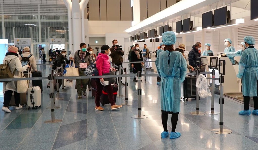 The first batch of Hong Kong residents leaves the Diamond Princess cruise ship to return to Hong Kong. Photo: HKISD