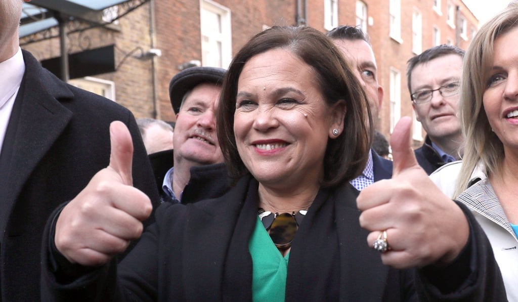 Sinn Fein leader Mary Lou McDonald gestures as she makes her way to Leinster House for the first sitting of the 33rd Dail on Thursday. Photo: PA Wire via dpa