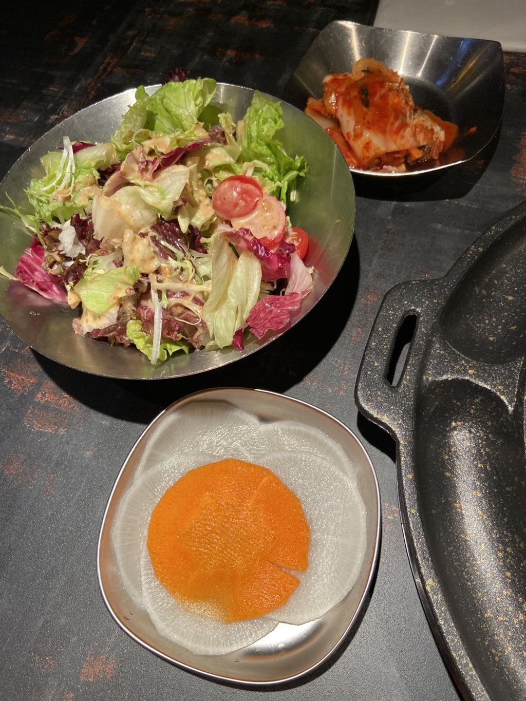 The banchan (side dishes) are kept generously topped up. Photo: Susan Jung