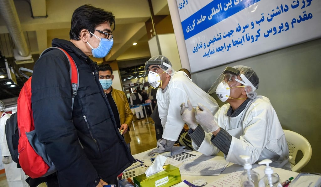 Health workers at Hamid Karzai International Airport in Kabul screen a passenger returning from China in the wake of the coronavirus outbreak. Photo: AFP Health workers at Hamid Karzai International Airport in Kabul screen a passenger returning from China in the wake of the coronavirus outbreak. Photo: AFP