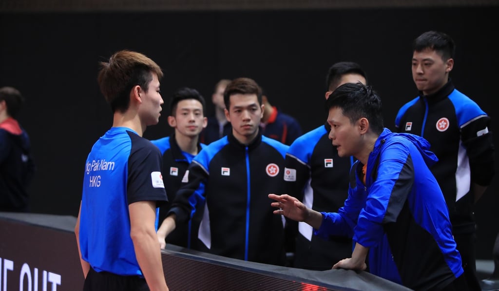 Ng Pak-nam gets advice from coach Leung Chu-yan in Portugal, where Hong Kong clinched qualification for the men’s team event for the 2020 Olympics. Photo: ITTF
