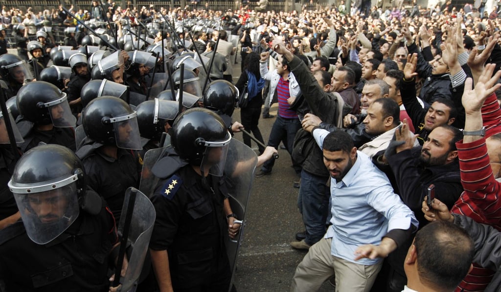 Police clash with protesters in Cairo in January 2011. Photo: AP