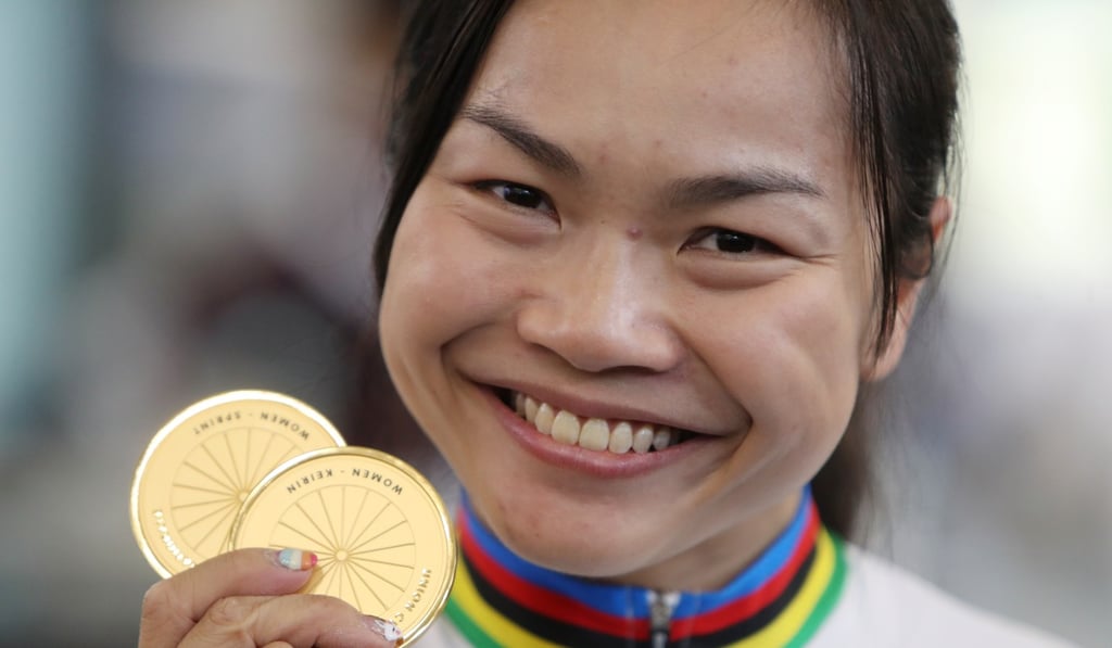 Sarah Lee with her two world championships gold medals in the sprint and keirin. Photo: Winson Wong