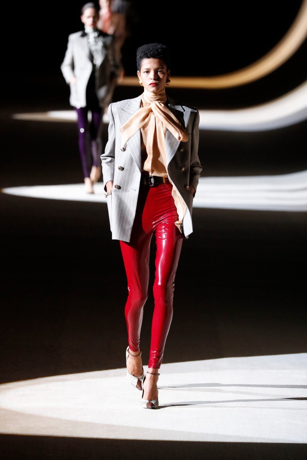 Saint Laurent models were dressed demurely in pussy-bow blouses and conventionally-tailored tweed jackets. Photo: Xinhua