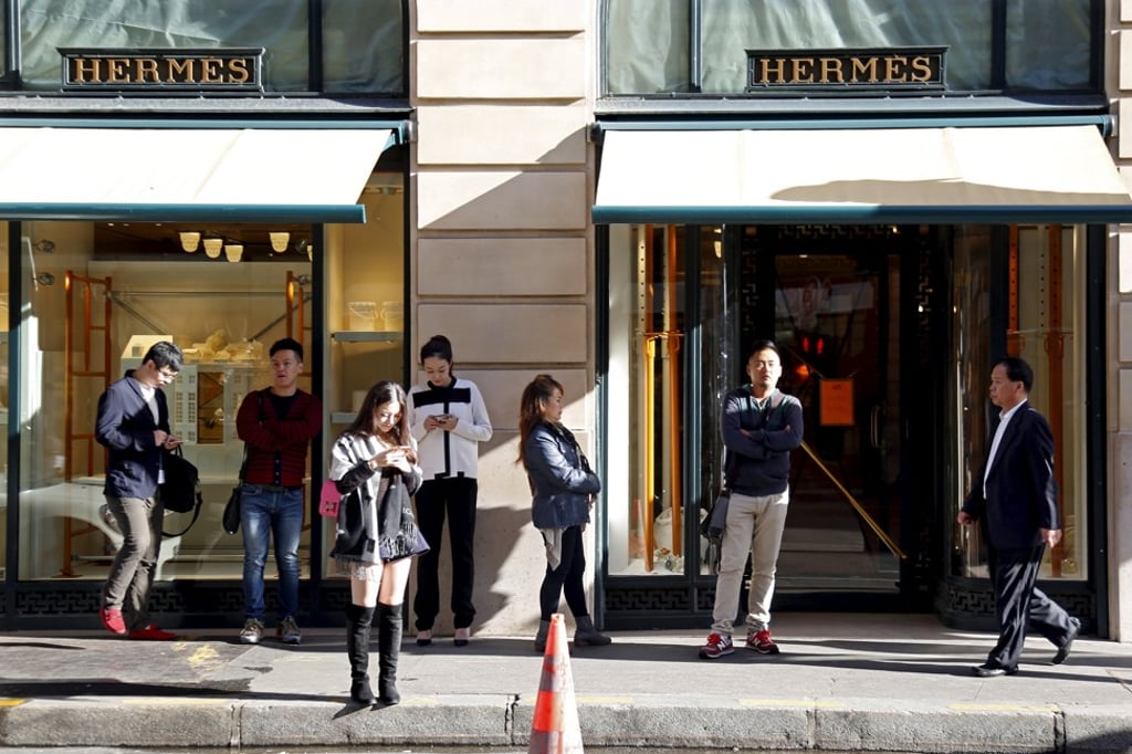 Chinese shoppers make the bulk of luxury purchases abroad, such as in Paris. Photo: Reuters