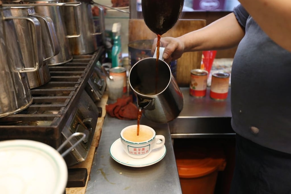 Kitchen staff prepare milk tea, at Lan Fong Yuen in Central, Hong Kong. Photo: Roy Issa