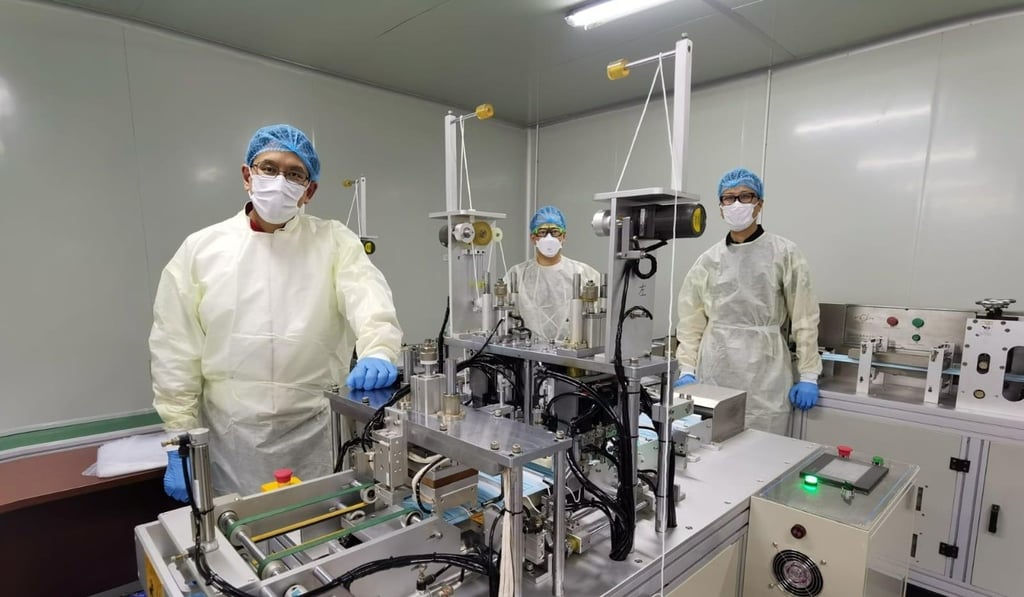 Edwin Cheng and his team on the production line that will aim to produce 12 million masks. Photo: Handout