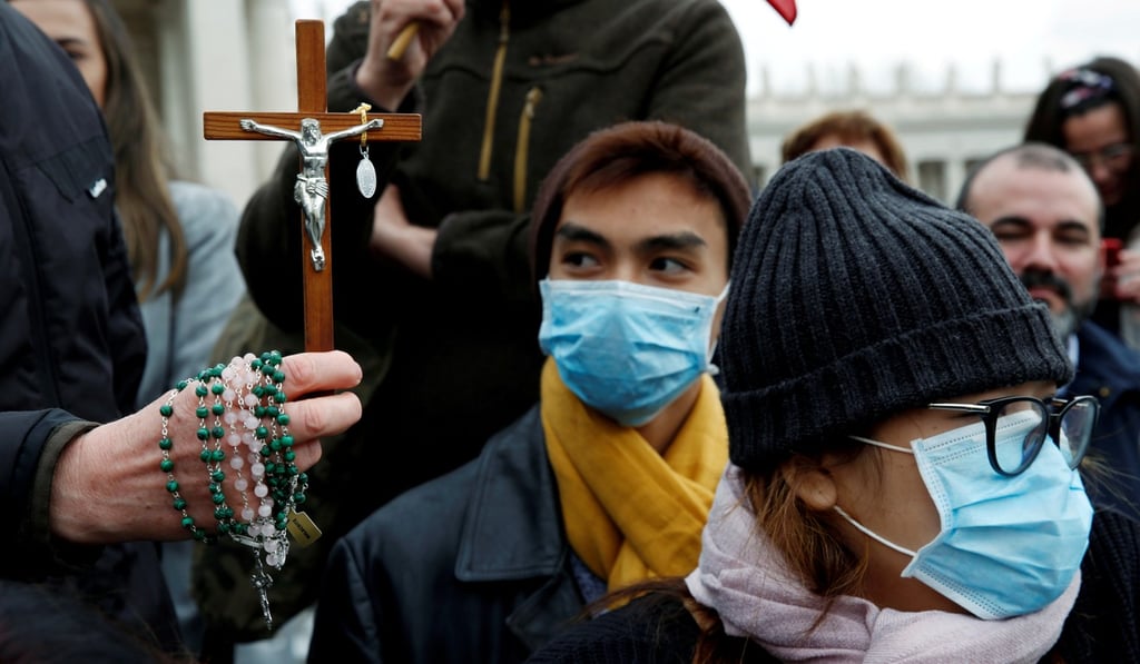 People wearing face masks attend the weekly general audience with Pope Francis at the Vatican on Wednesday. Photo: Reuters People wearing face masks attend the weekly general audience with Pope Francis at the Vatican on Wednesday. Photo: Reuters