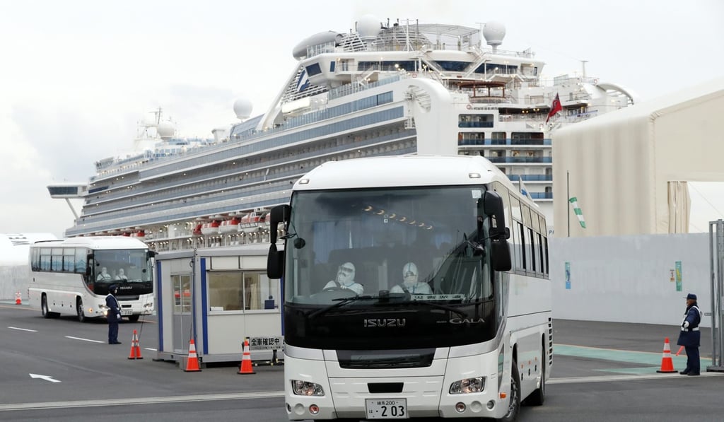 Passengers from the quarantined Diamond Princess cruise ship leave a port in Yokohama. Photo: AP