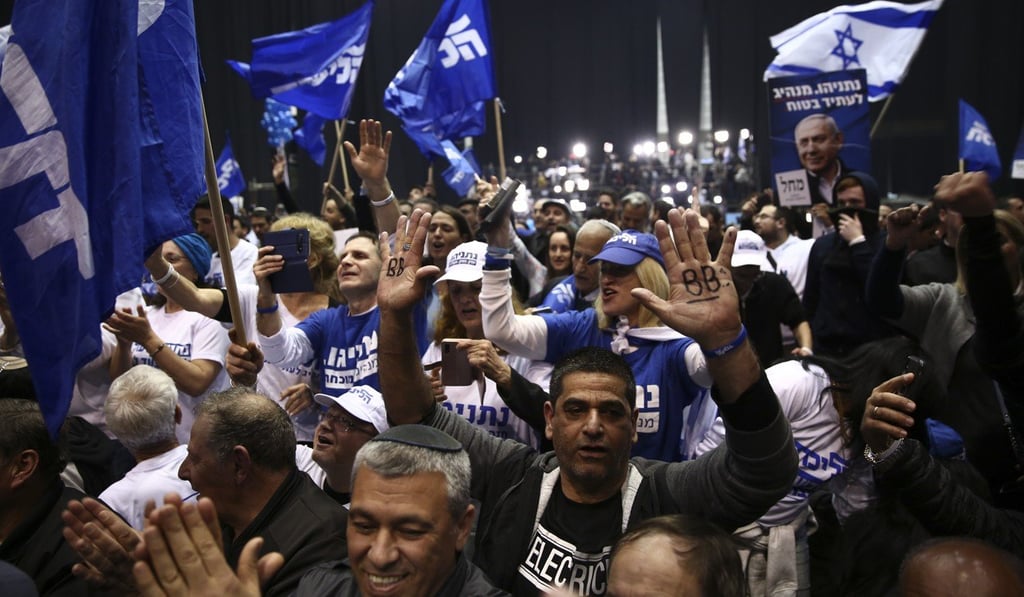 Supporters of Israeli Prime Minister Benjamin Netanyahu celebrate after the first election exit poll results in Tel Aviv on Monday. Photo: AP