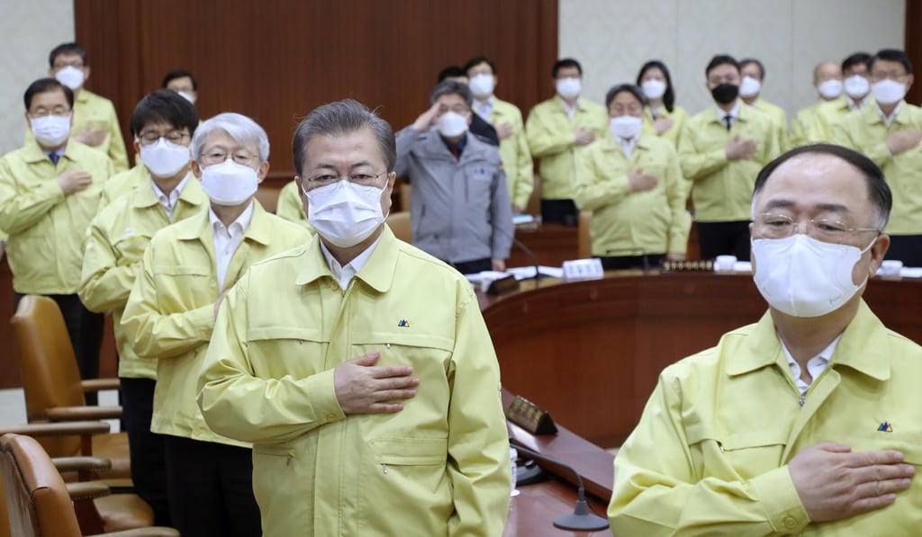 South Korean President Moon Jae-in salutes the national flag during a cabinet meeting. Photo: AP South Korean President Moon Jae-in salutes the national flag during a cabinet meeting. Photo: AP