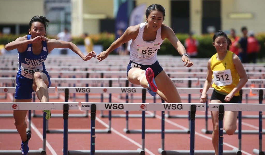 Vera Lui races in the 100m hurdles at last year’s Hong Kong Championships at Wan Chai Sports Ground. Photo: Sam Tsang