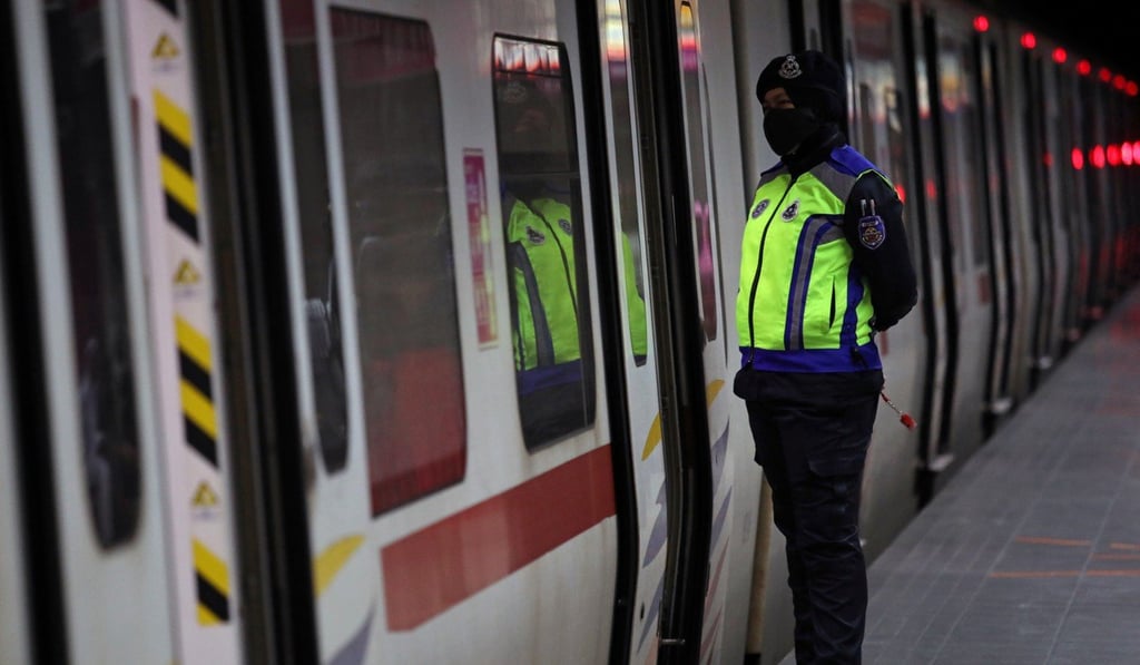 A police officer wears protective mask at a train station in Kuala Lumpur, on March 3, 2020. Photo: Reuters