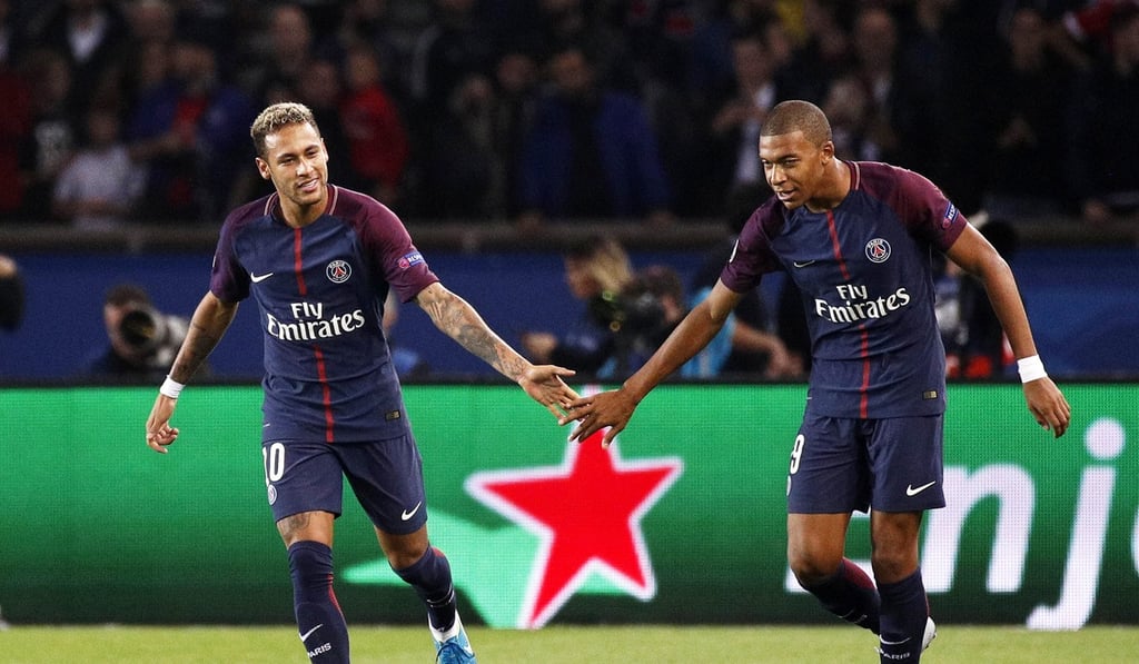 Neymar celebrates with Mbappe after scoring against Bayern Munich in 2017. Photo: EPA