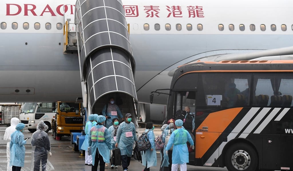 Hong Kong residents arrive on the first government-chartered flight from Wuhan in mainland China on Wednesday. Photo: Information Services Department