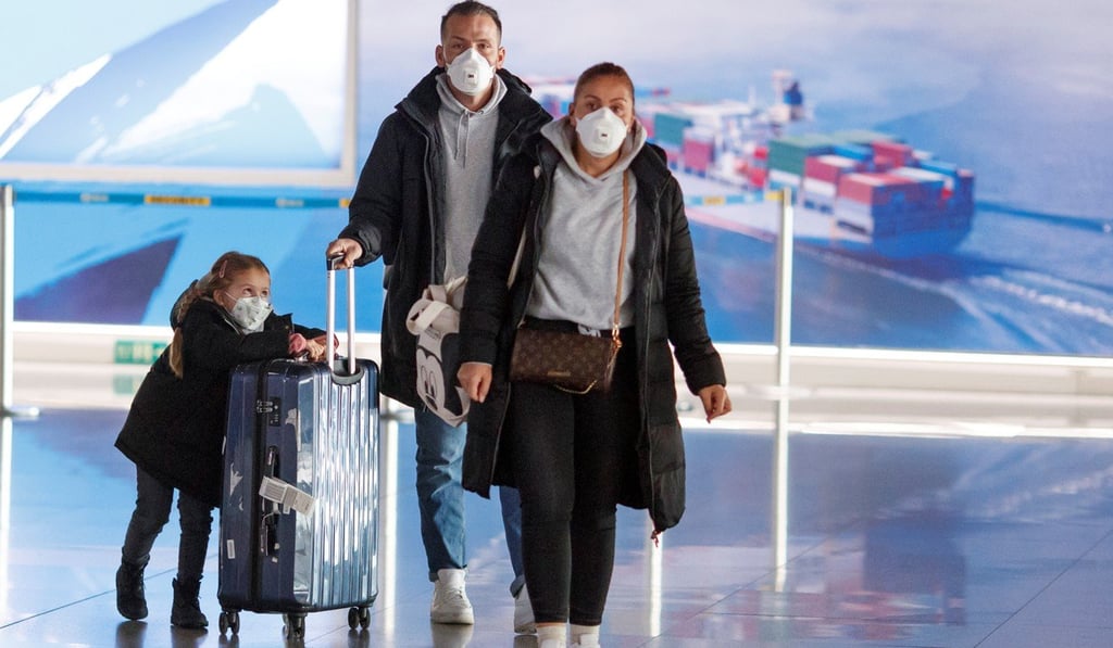 Travellers arrive in Beijing on Wednesday as the coronavirus continues to spread. China’s permanent residency requirements are some of the toughest in the world. Photo: Reuters