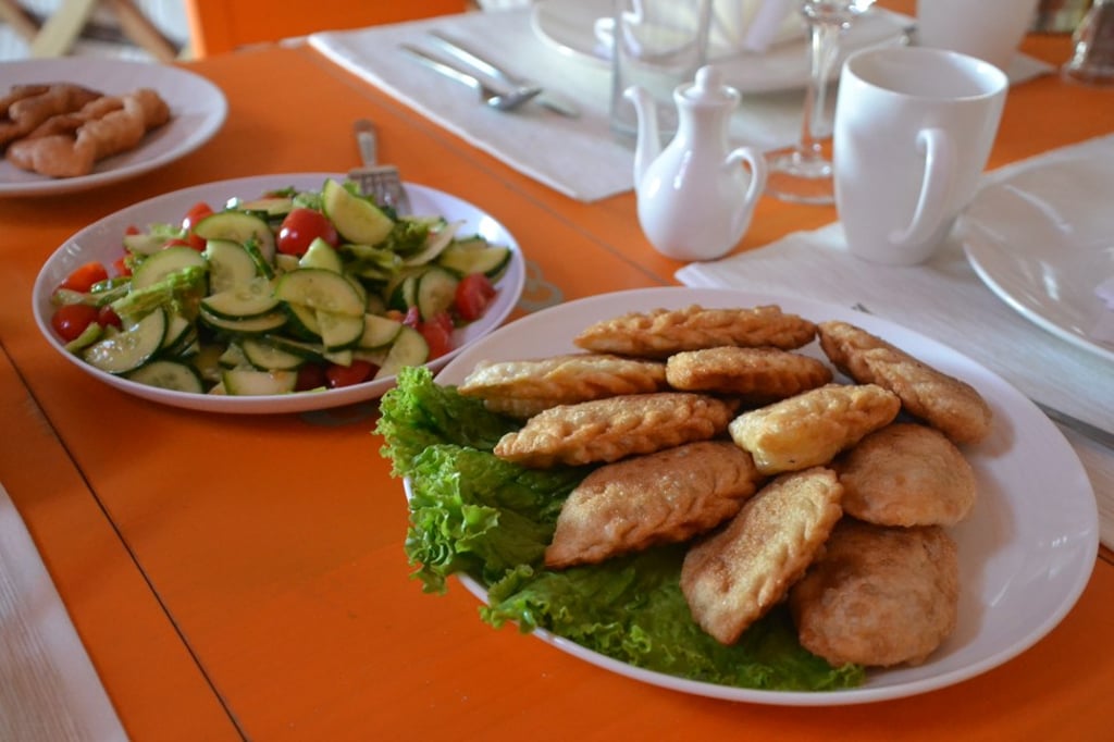 The deep fried lamb pastries, called khuushuur, may be spiced with wild garlic or nettles. The deep fried lamb pastries, called khuushuur, may be spiced with wild garlic or nettles.