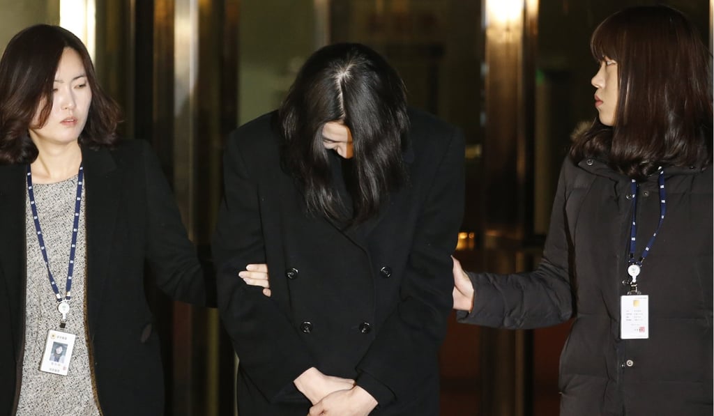 Heather Cho, also known as Cho Hyun-ah, the daughter of chairman of Korean Air, Cho Yang-ho, leaves for a detention facility after a Korean court ordered her to be detained in 2014. Photo: Reuters