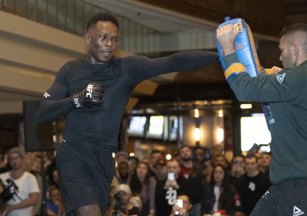 Israel Adesanya works on his timing with coach Andrei Paulet. Photo: AP