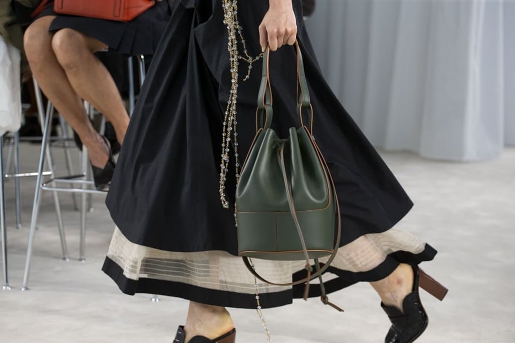 The bag comes in natural tones, like taupe, vintage khaki and soft white, as well as two-tone variations of smooth hazelnut-and-tan, black-and-tan, and topaz-and-black calfskin. Photo: Loewe
