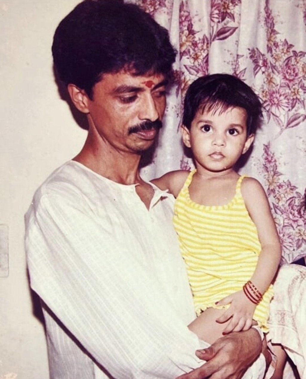 Thakur as a baby and with her father. Photo: Maithili Thakur