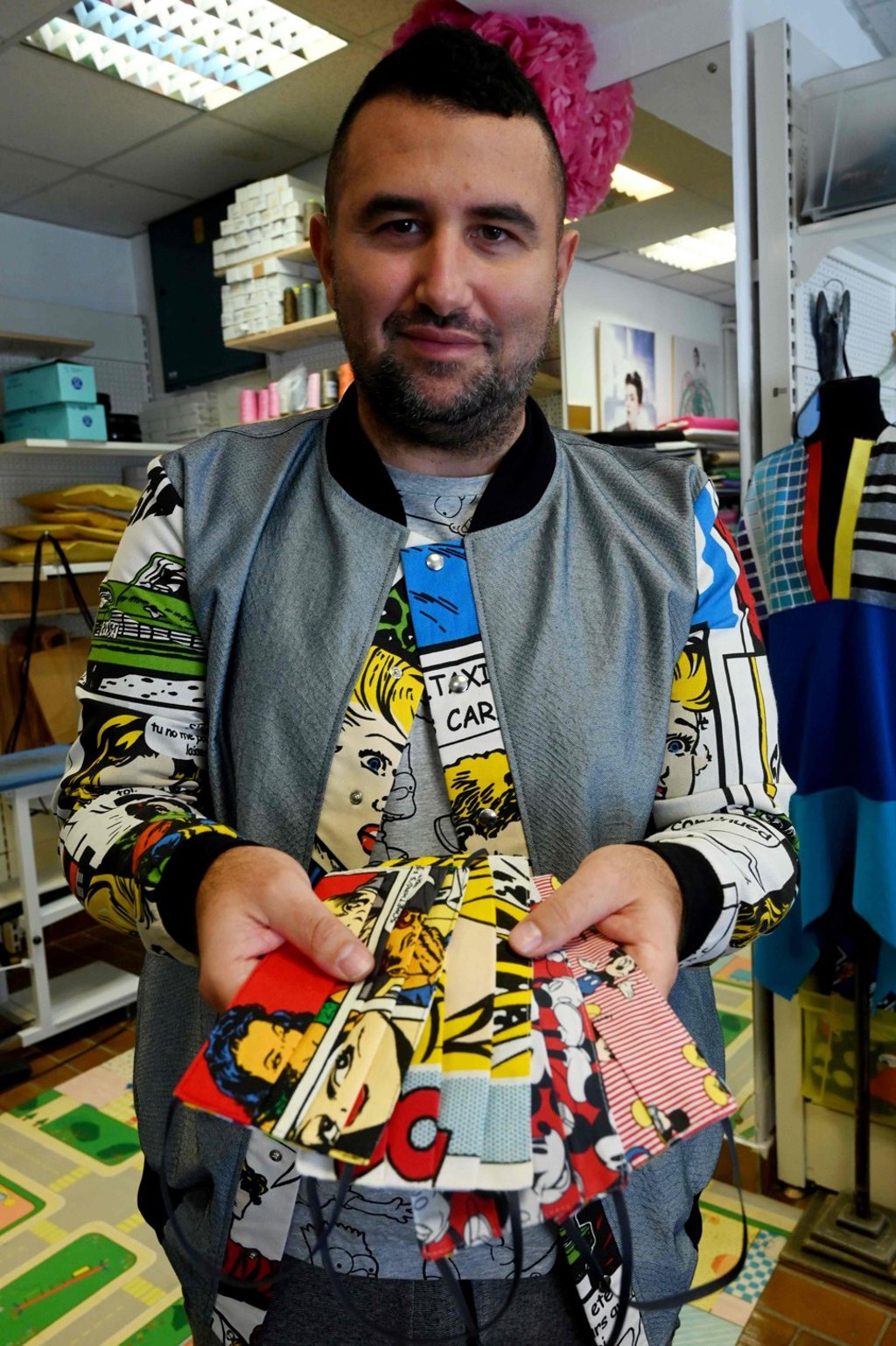 Croatian designer Aragovic shows a selection of face masks with his designs on them. Photo: AFP Croatian designer Aragovic shows a selection of face masks with his designs on them. Photo: AFP