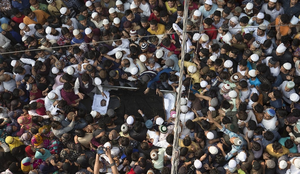 People carry the body of a riot victim during a funeral procession in Delhi last month. Photo: Xinhua People carry the body of a riot victim during a funeral procession in Delhi last month. Photo: Xinhua