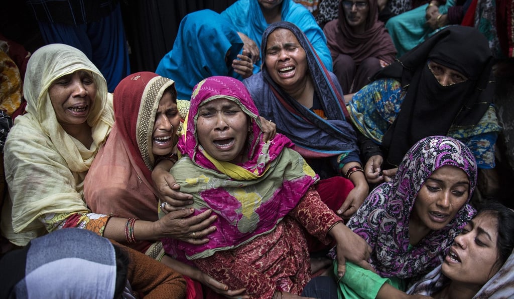 Women in Delhi mourn relatives who were killed in the communal violence. Photo: Xinhua Women in Delhi mourn relatives who were killed in the communal violence. Photo: Xinhua