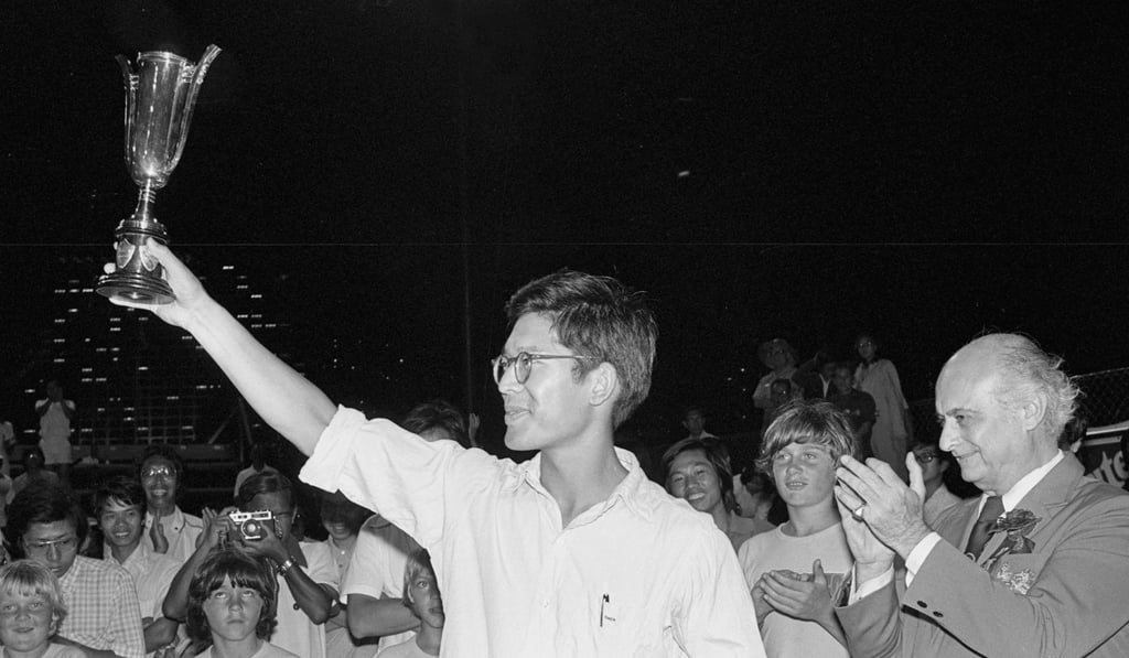 Randall King holds aloft his trophy after winning the men’s singles title at the Hong Kong Invitation Hardcourt Tennis Championships at Victoria Park.