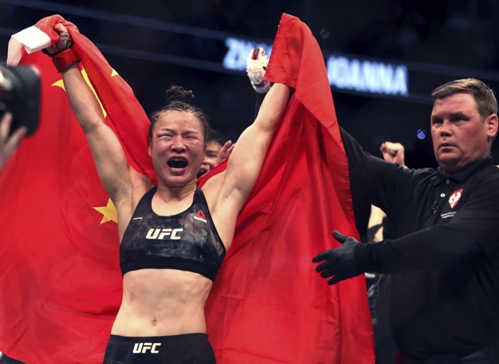 Zhang Weili celebrates her win by decision over Joanna Jedrzejczyk at UFC 248. Photo: AP