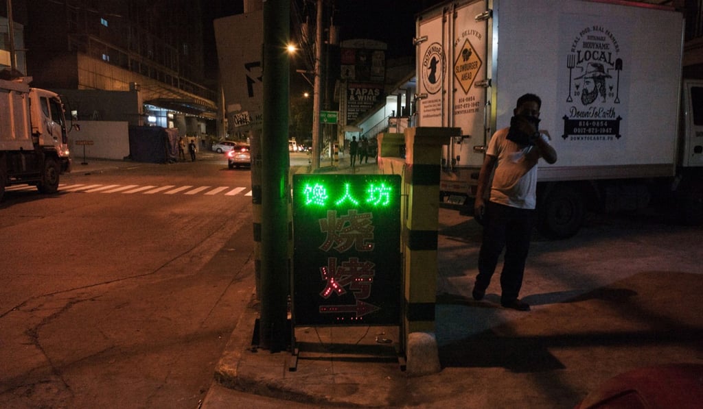 An illuminated sign for a Chinese restaurant in Makati City, Manila. Photo: Carlo Gauco/Bloomberg An illuminated sign for a Chinese restaurant in Makati City, Manila. Photo: Carlo Gauco/Bloomberg