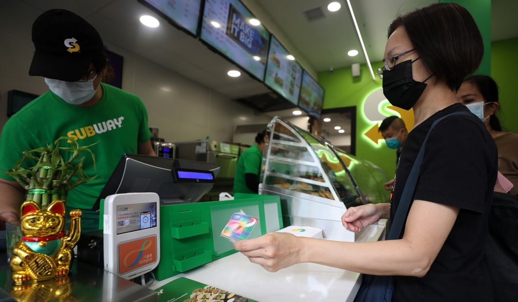 A customer uses her Octopus card in Quarry Bay. Photo: Xiaomei Chen